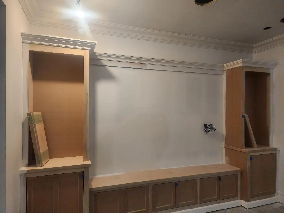 Built-in bench and cabinetry installed along a living room wall
